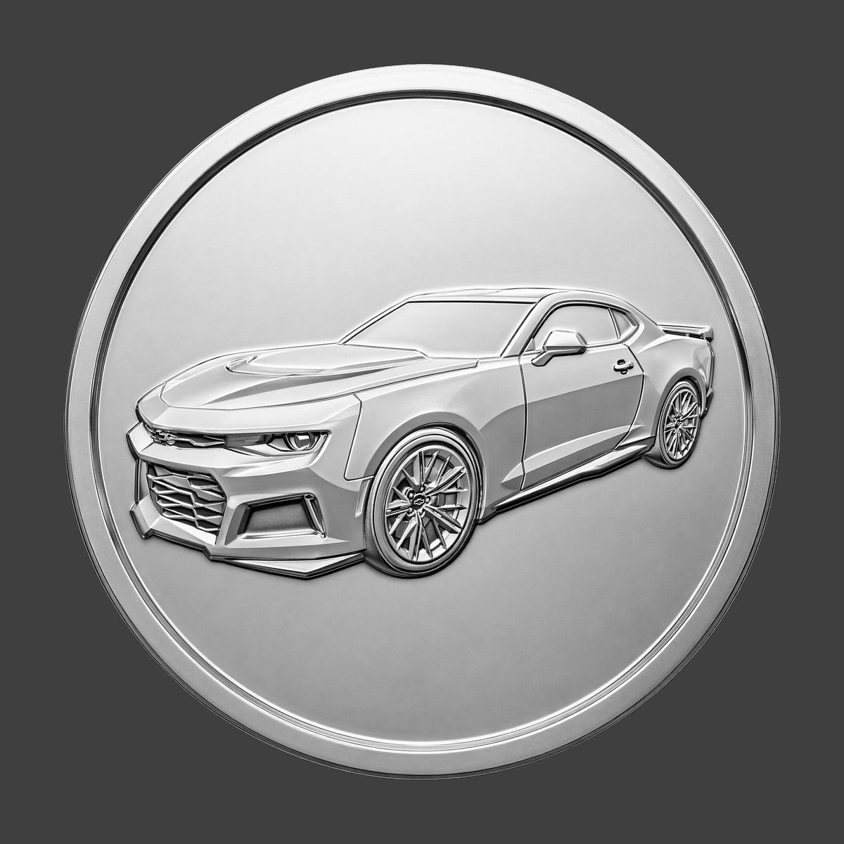 A silver finished, resin sculpted coin of a Chevy Camaro ZL1