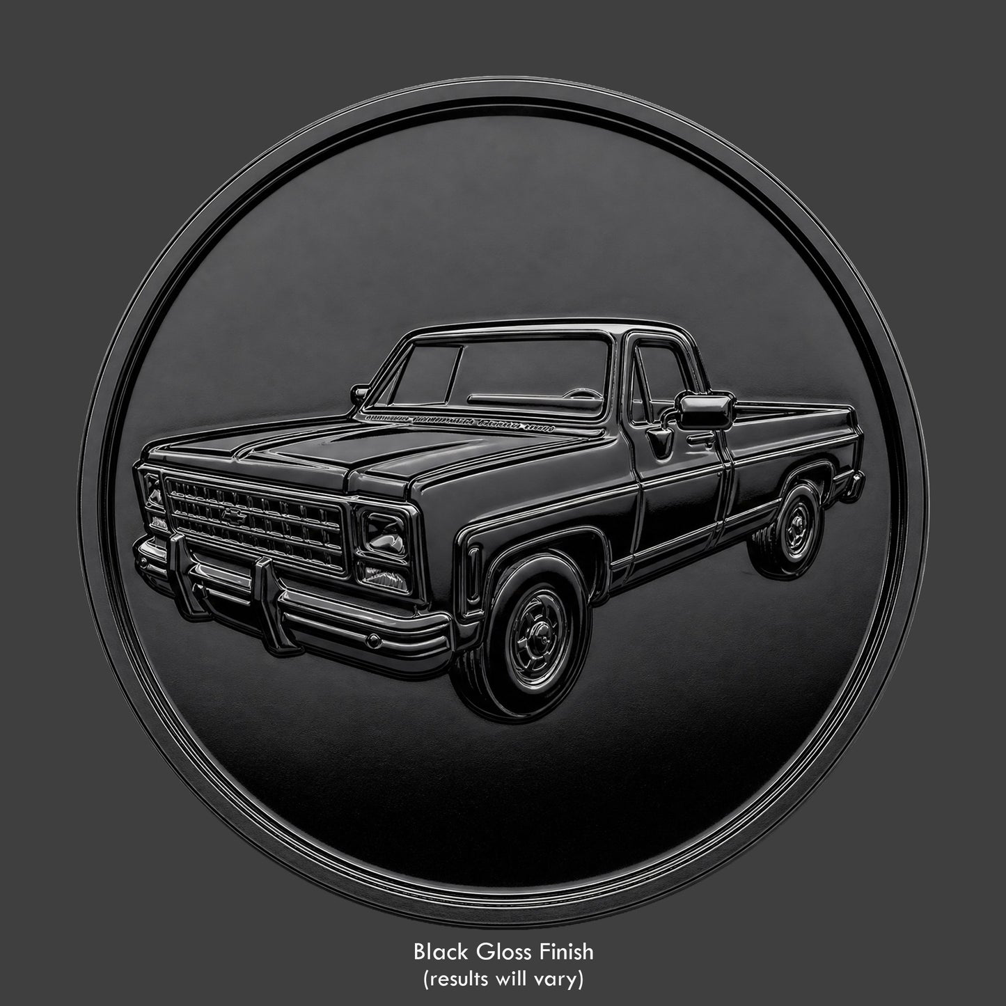 A brass finished, resin sculpted coin of a square body truck