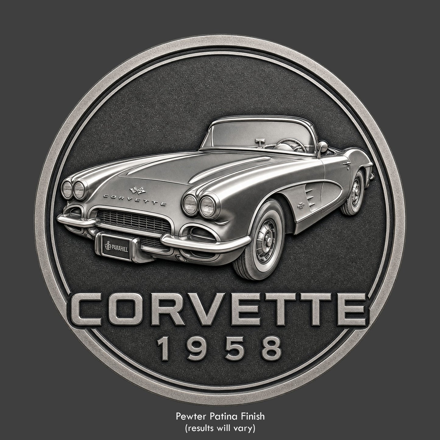 A pewter finished, resin sculpted coin of a 1958 convertible Corvette
