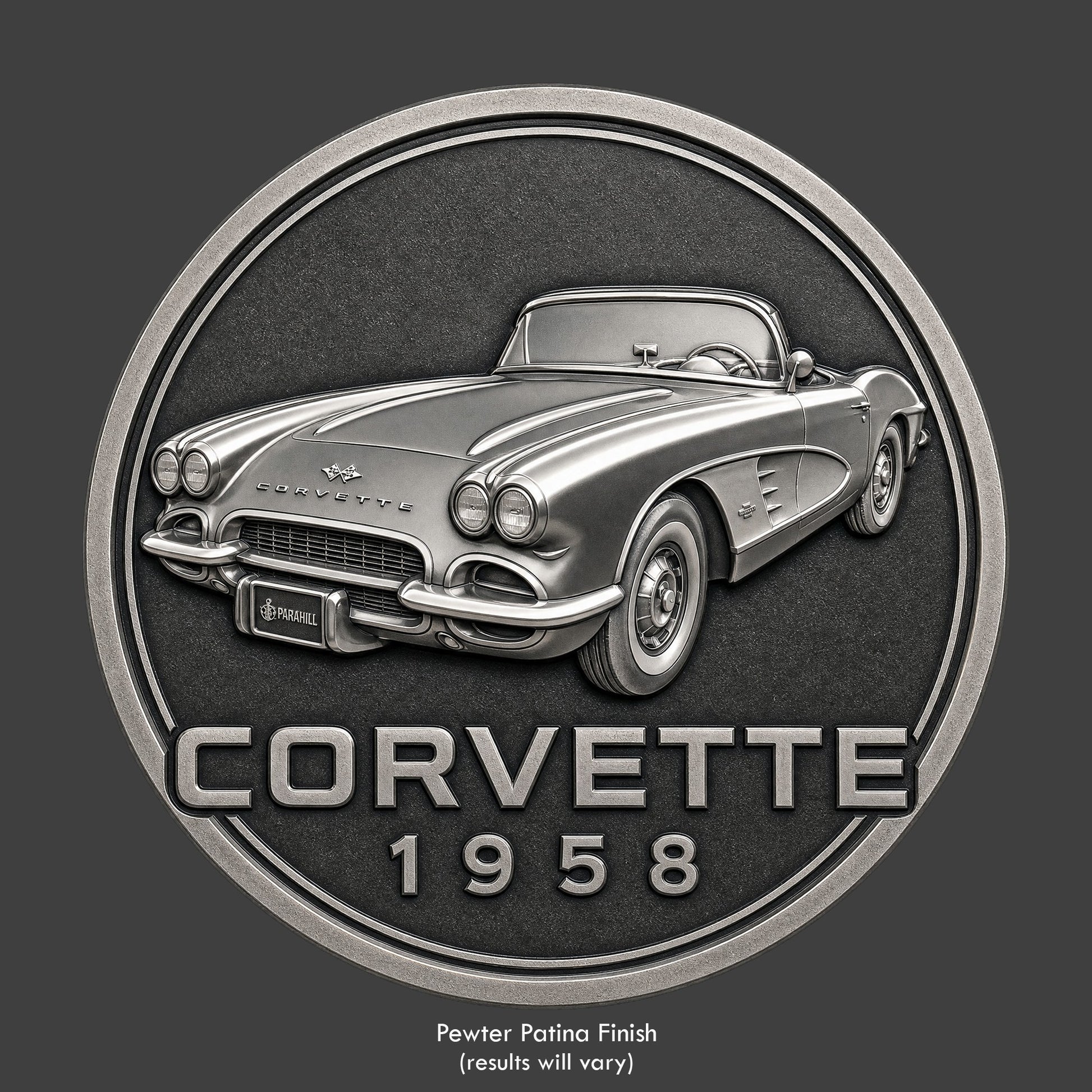 A pewter finished, resin sculpted coin of a 1958 convertible Corvette