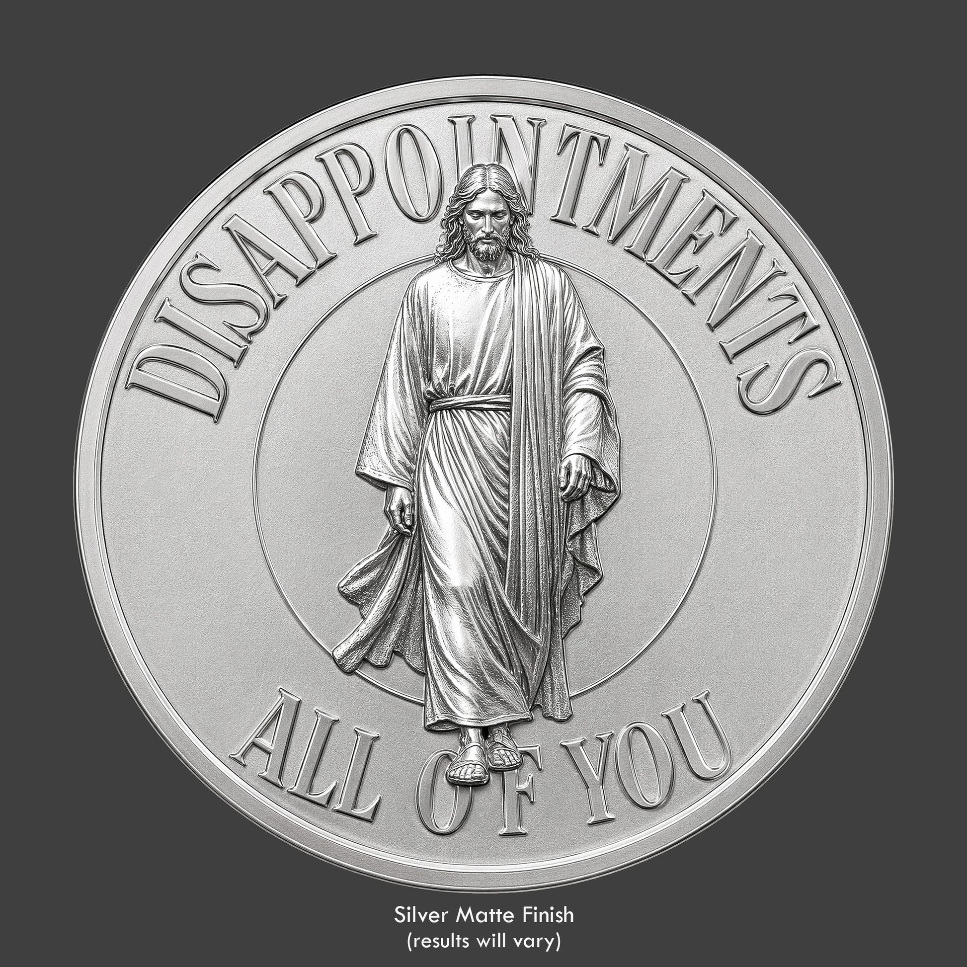 A silver finished, resin sculpted coin of a disappointed Jesus