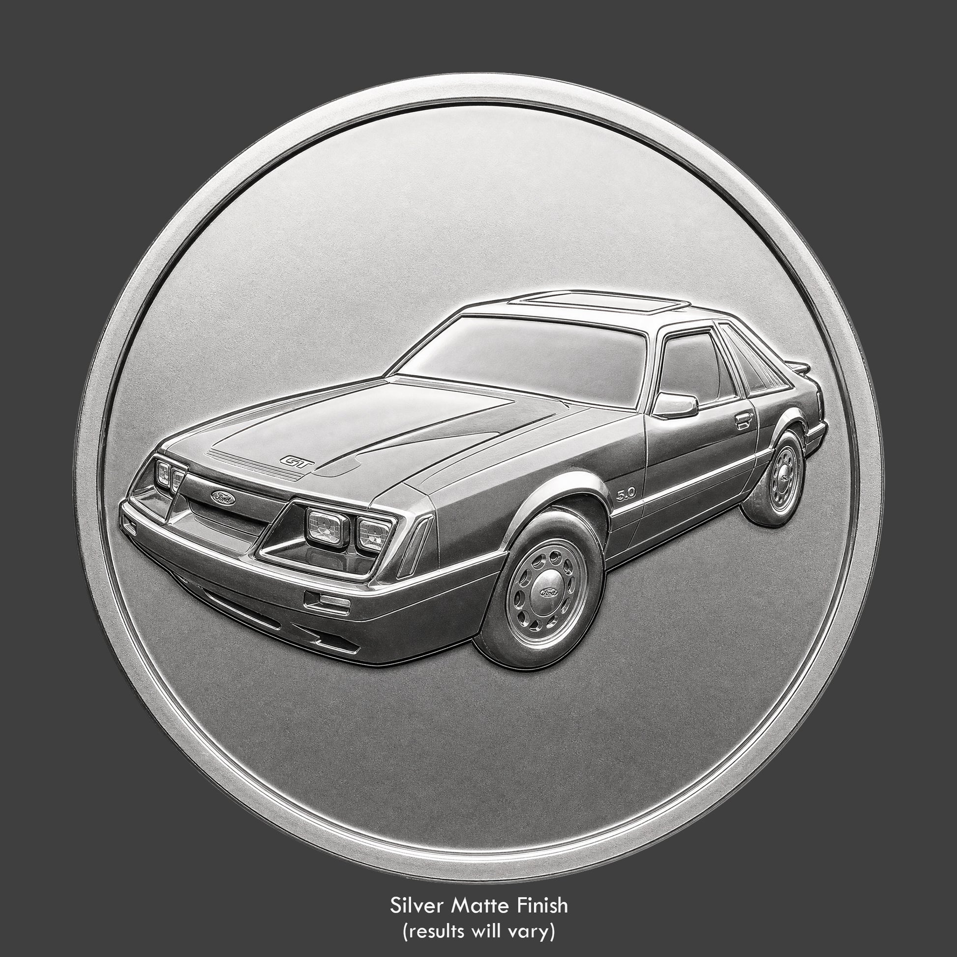 A silver finished, resin sculpted coin of a Ford Mustango GT