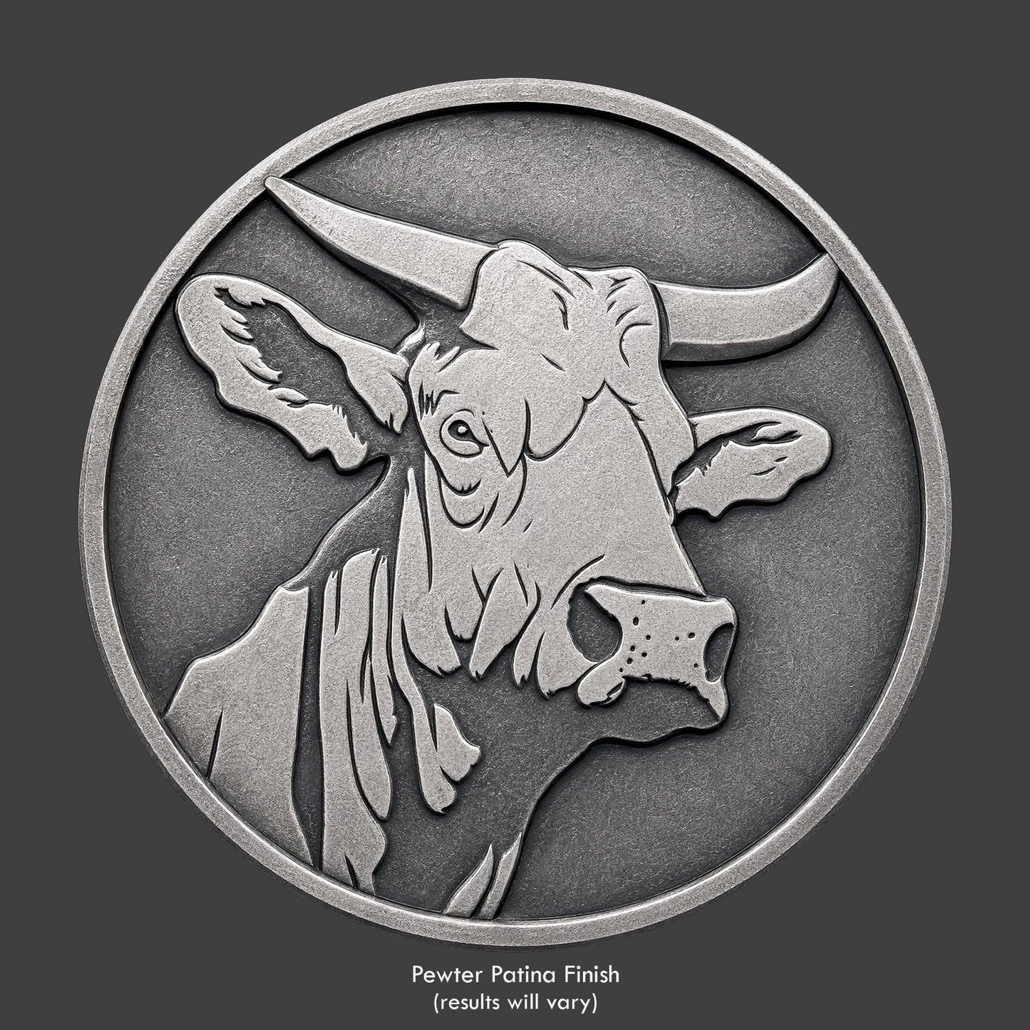 A pewter finished, resin sculpted coin of a bull