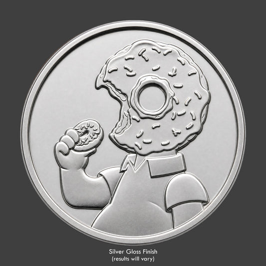 A silver finished, resin sculpted novelty coin of a Homer Simpson
