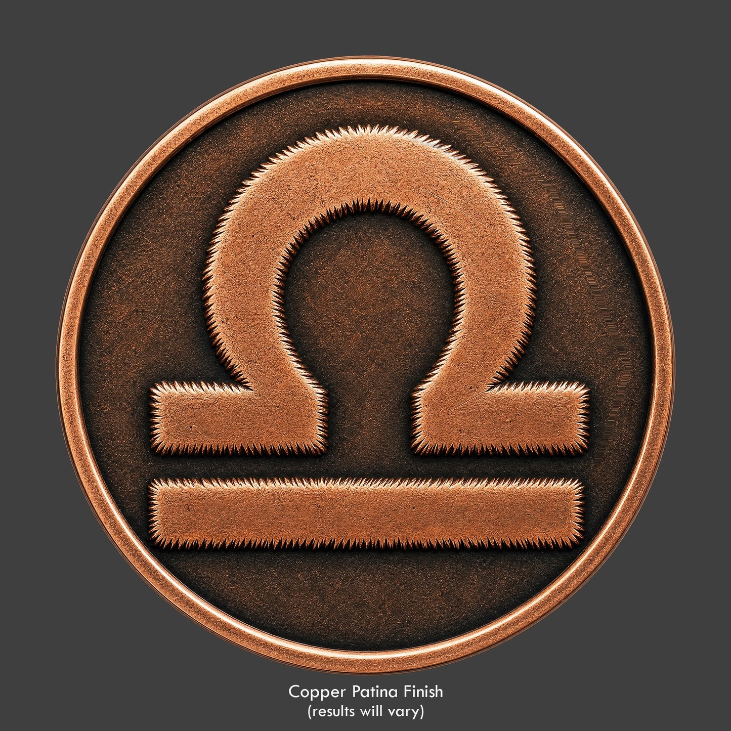 A Libra Zodiac symbol on a copper patina coin