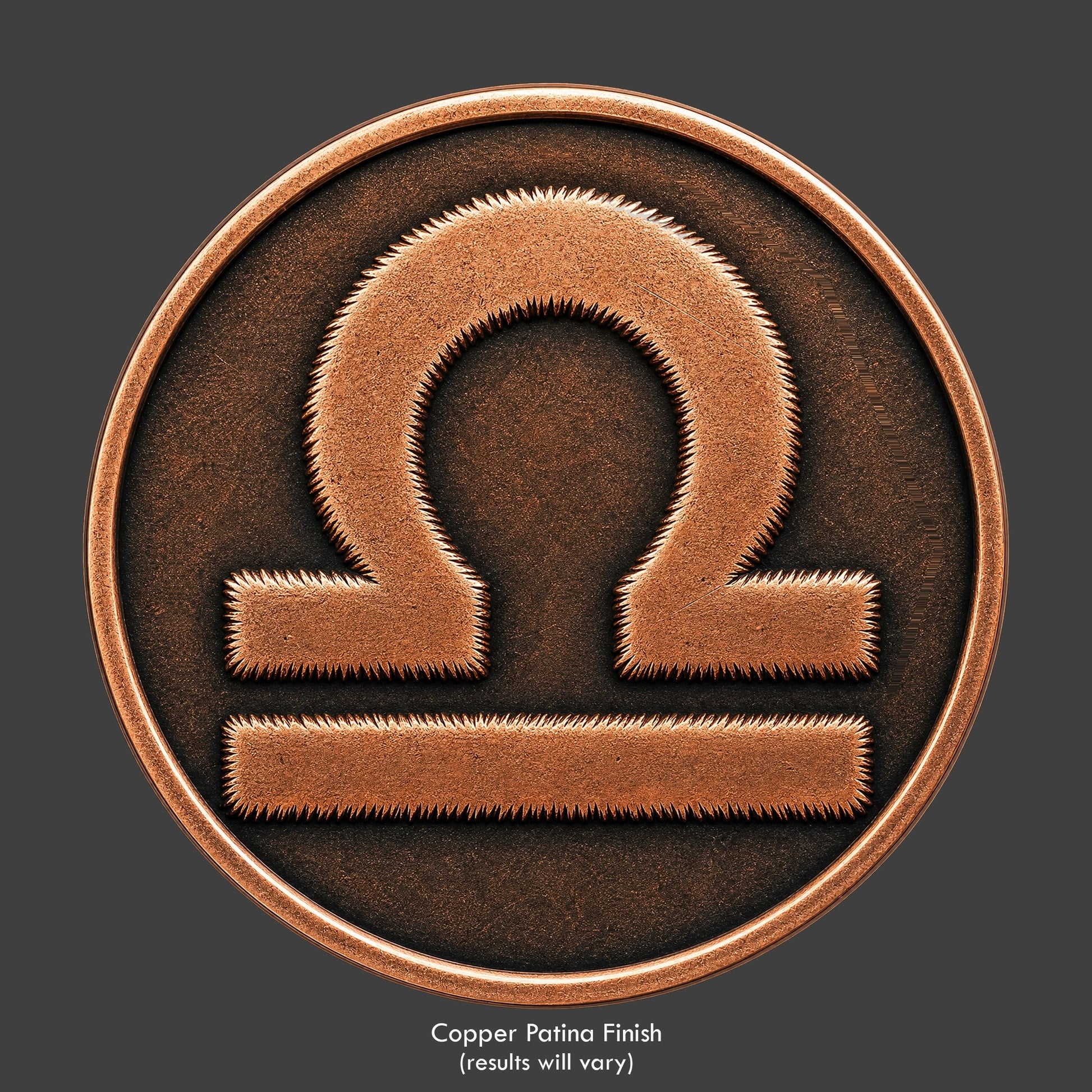 A Libra Zodiac symbol on a copper patina coin