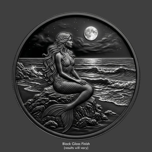 A mermaid sitting at the beach watching the waves roll in