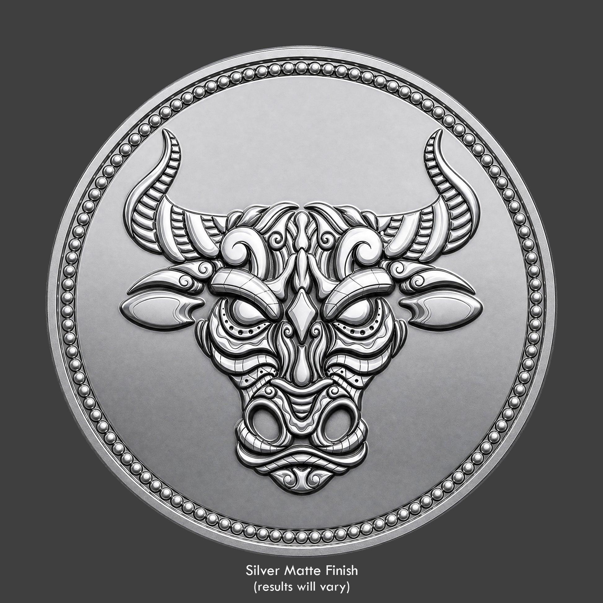 A silver finished, resin sculpted coin of a ornate bull