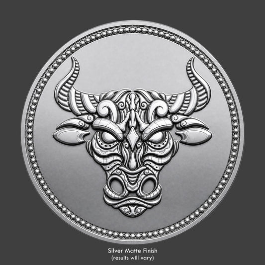A silver finished, resin sculpted coin of a ornate bull