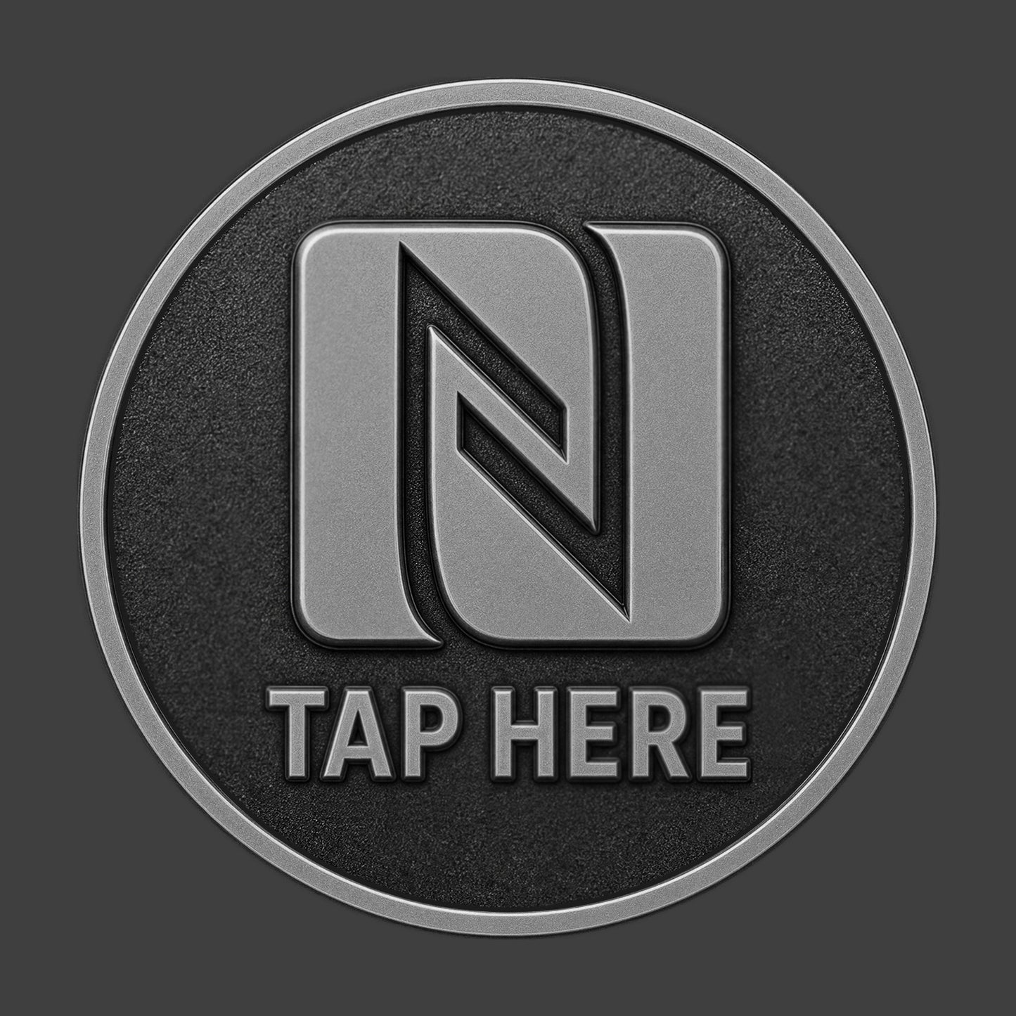 A pewter TapCoin with an NFC logo