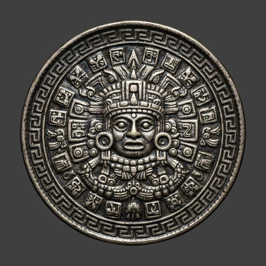 A Mayan pewter patina finished coin