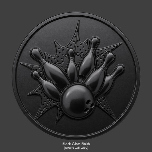 A bowling alley strike on a gloss black coin