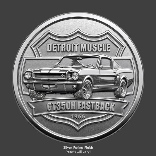 A silver finished, resin sculpted coin of a Shelby GT350 Mustang