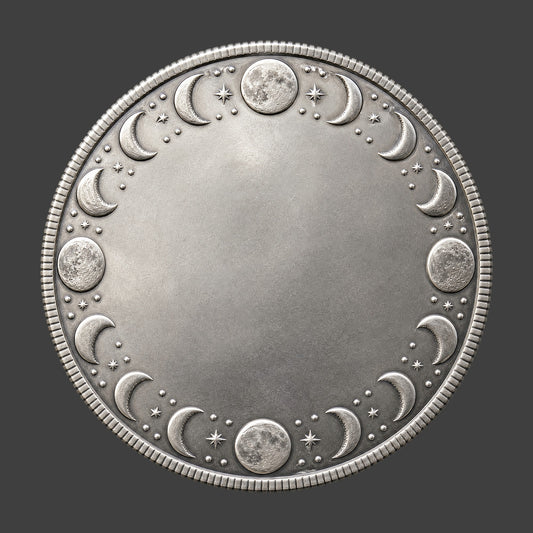 Decorative silver coin with moon phases on a dark background