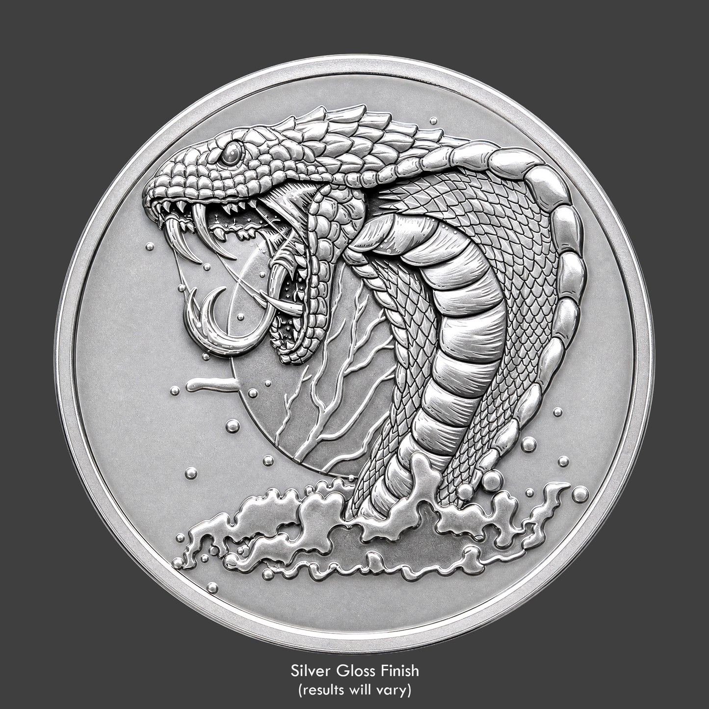 A silver finished, resin sculpted coin of a vicious cobra snake