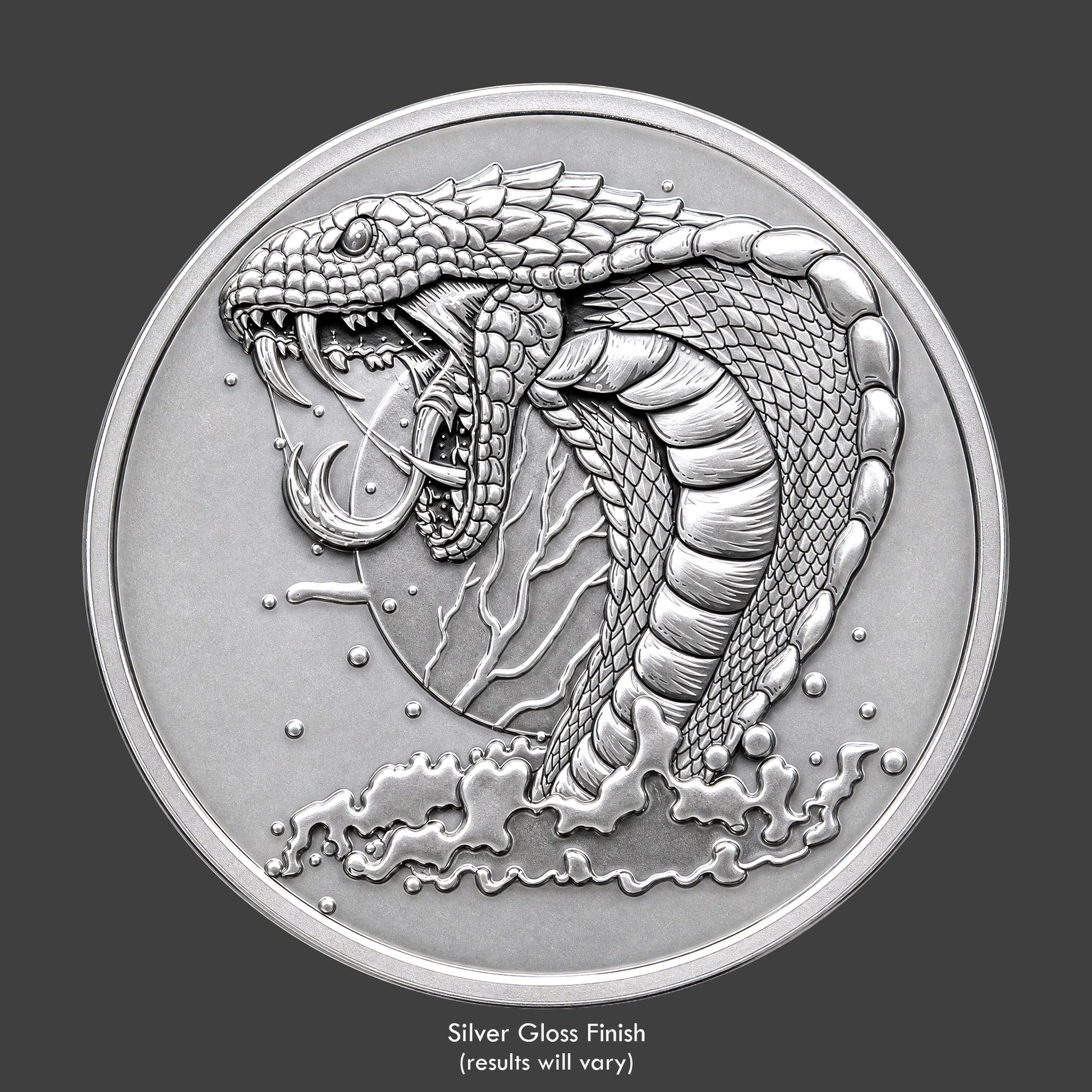 A silver finished, resin sculpted coin of a vicious cobra snake
